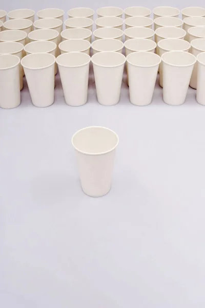 A group of paper cups with an isolated paper cup