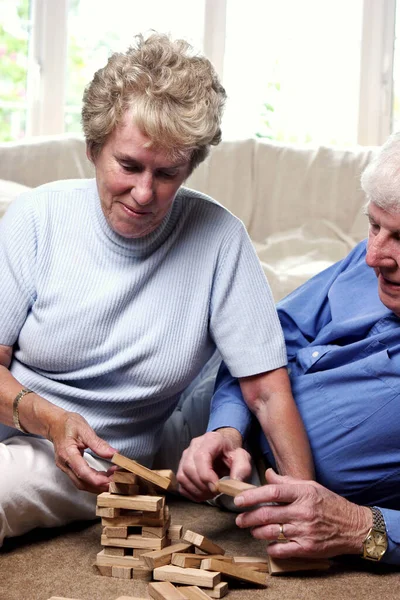 Old Couple Playing Building Blocks — Stock Photo, Image