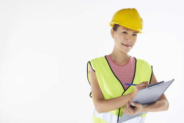 Bauarbeiter Schreibt Notizen — Stockfoto