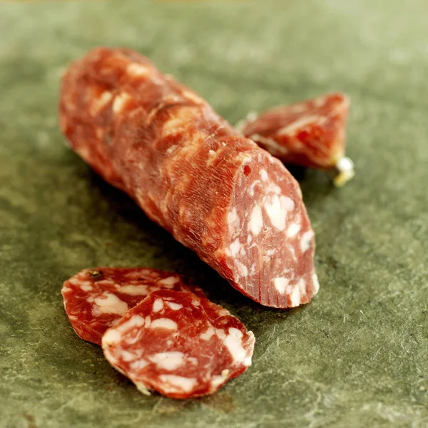 Freshly Sliced Italian Salami Sausage Slate — Stock Photo, Image