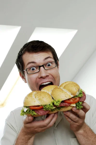 Greedy Man Trying Eat Big Burger — Stock Photo, Image