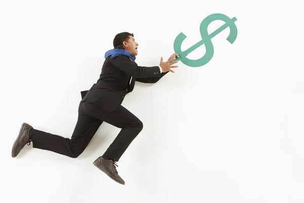 Biznesmen Trzymający Się Znaku Dolara — Zdjęcie stockowe