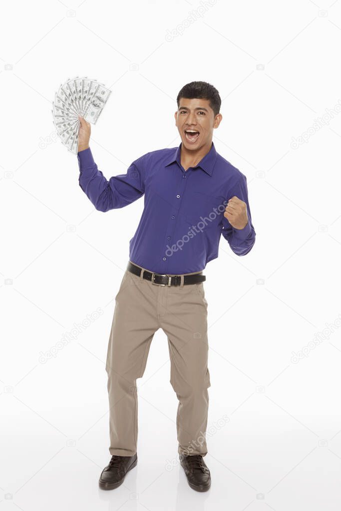 Businessman holding a lot of money