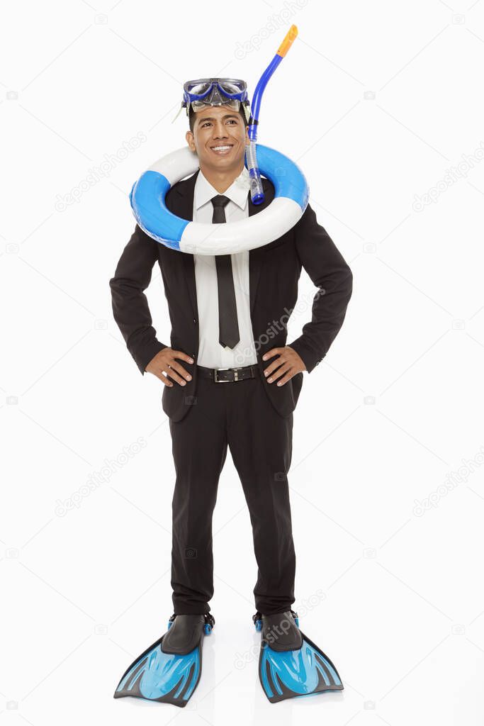 Businessman with swimming gear smiling