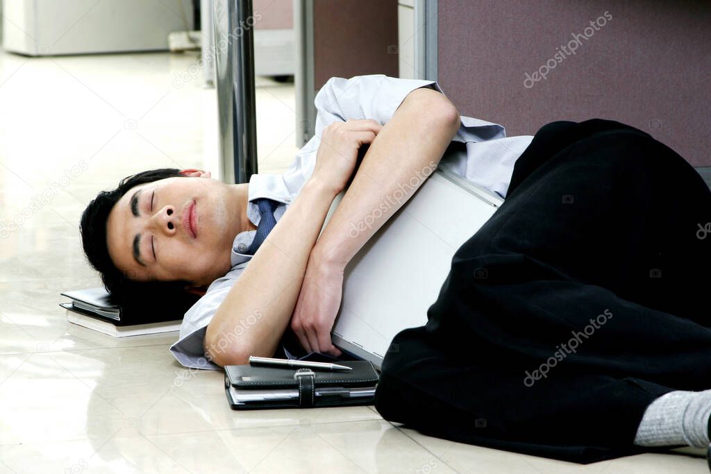 Man sleeping on the office floor