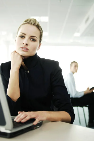 Young Businesswoman Using Laptop Stock Photo