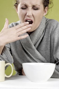 Woman yawning, close up view