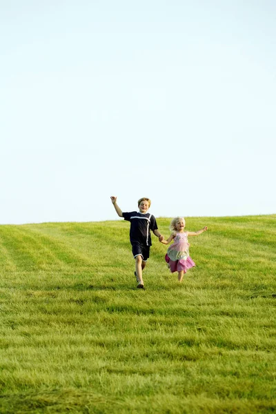 Children running at a field