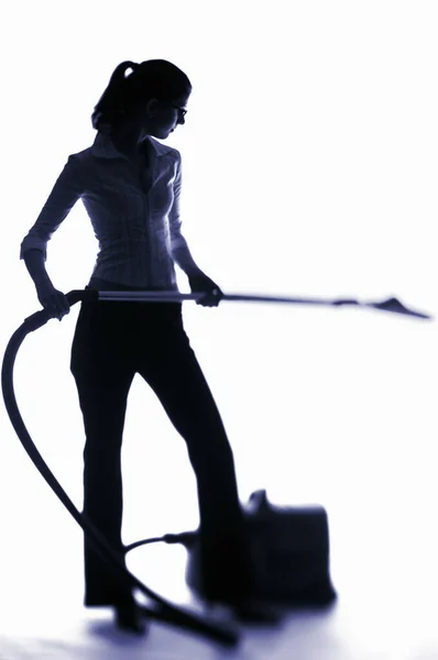 Businesswoman Using Vacuum Cleaner — Stock Photo, Image