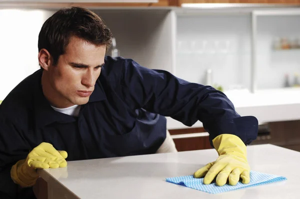 Young Man Wiping Table — Stock Photo, Image