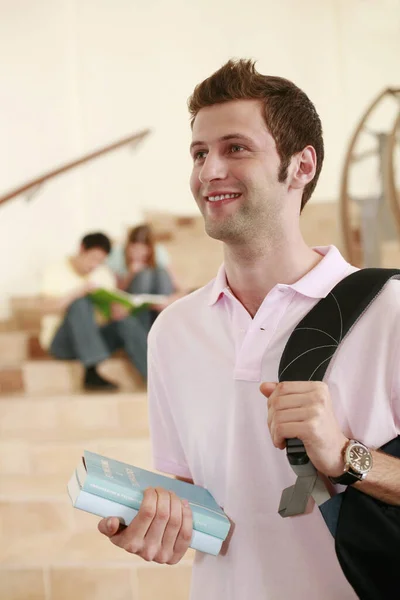 Man Carrying Backpack While Two People Having Discussion Background —  Fotos de Stock