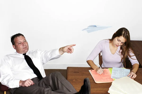 Businessman Playing Paper Plane While His Colleague Busy Working — Stock Photo, Image