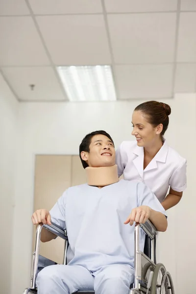 Nurse Pushing Patient Wheelchair — Stock Photo, Image