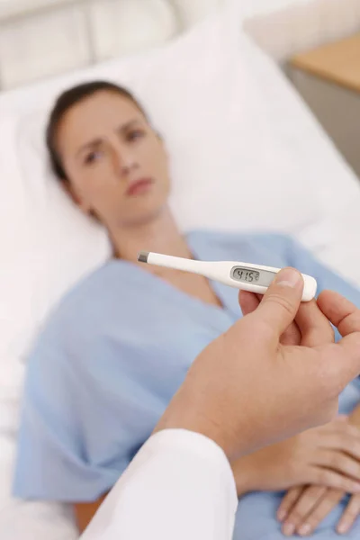 Doctor Holding Thermometer Patient Lying Bed — Stock Photo, Image