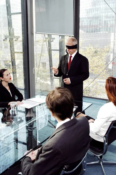 Blindfolded Businessman Talking Conference Room — Stockfoto
