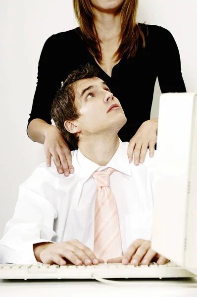 Businesswoman Giving Her Colleague Shoulder Massage Royalty Free Stock Photos