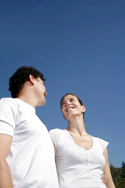 Couple Smiling While Looking Each Other Royalty Free Stock Images