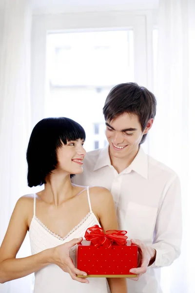 Man Giving His Wife Surprise Gift Stock Picture