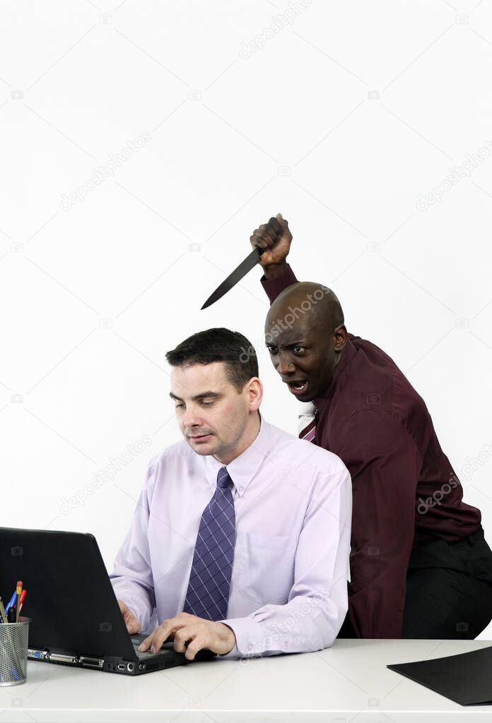 Businessman trying to stab his colleague with a knife