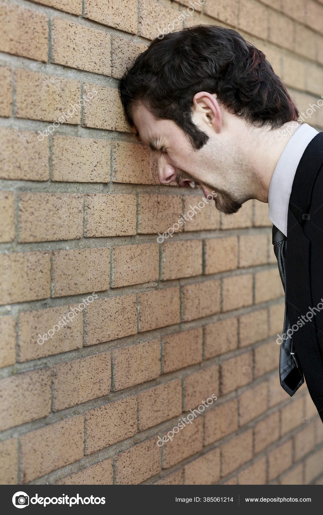 Businessman Banging His Head Wall Stock Photo by ©image_hit 385061214