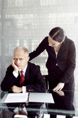 Businessman being consoled by his secretary clipart