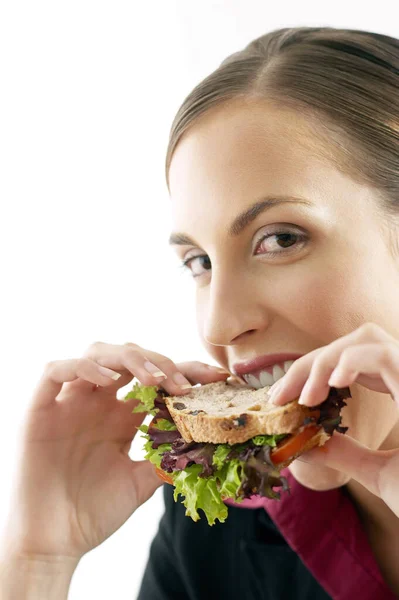 Businesswoman Biting Sandwich — Stock Photo, Image
