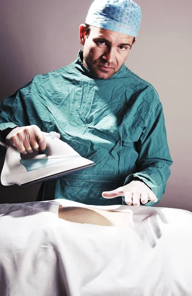 Man Surgeon Outfit Ironing Clothes — Stock Photo, Image