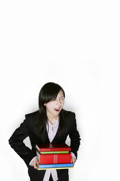 Businesswoman Carrying Heavy Stack Books — Fotografia de Stock