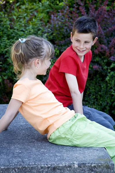 Boy Girl Chatting Outdoors Royalty Free Stock Photos