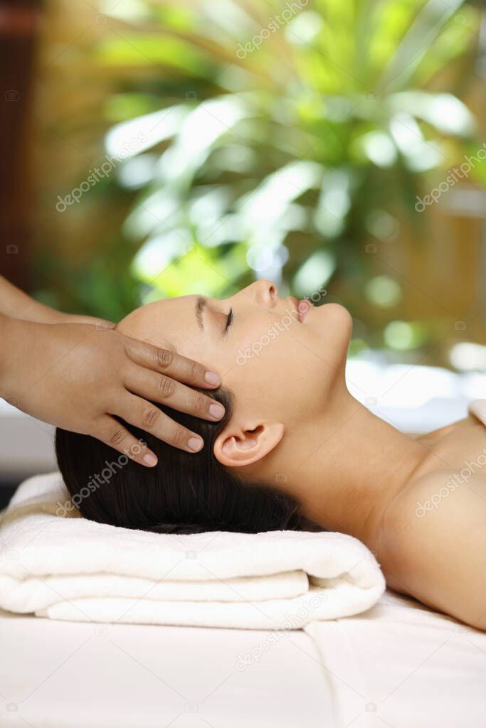 Woman enjoying a head massage