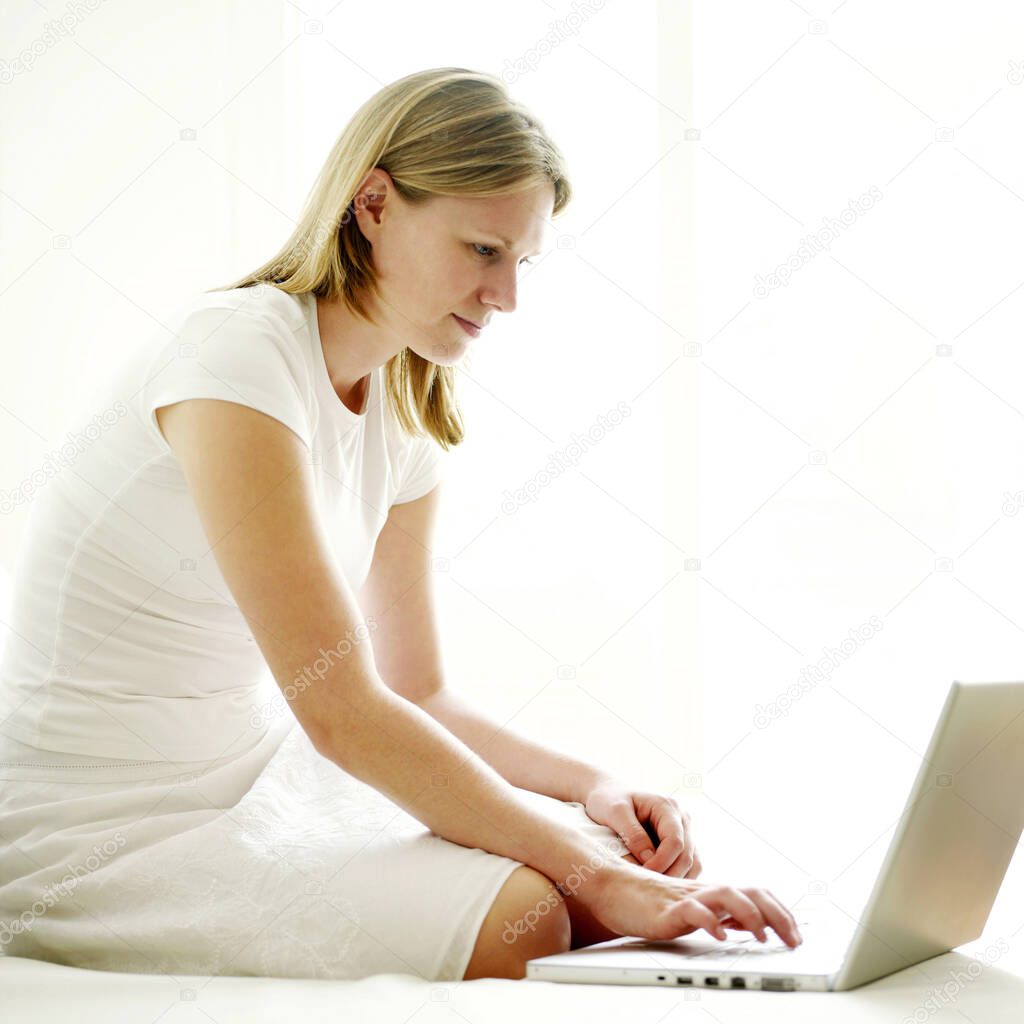 young woman using laptop