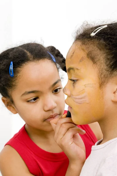 Girl Painting Her Sister Face — Stock Photo, Image