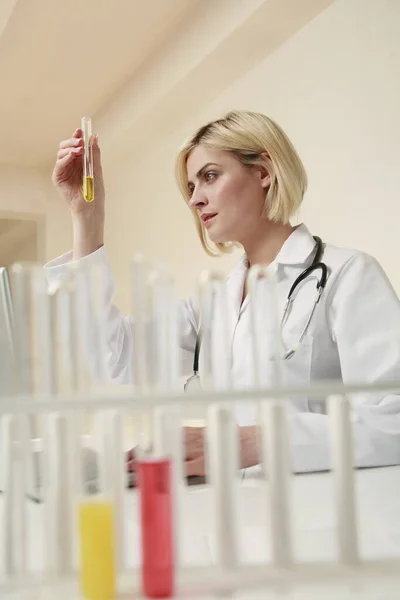 Woman Examining Liquid Test Tube — Stock Photo, Image