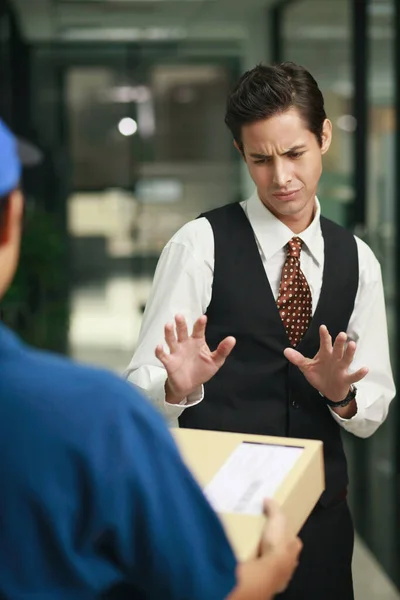 Businessman Rejecting Package Delivery Person — Stock Photo, Image