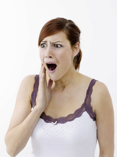 Woman in shock on white  on white background 