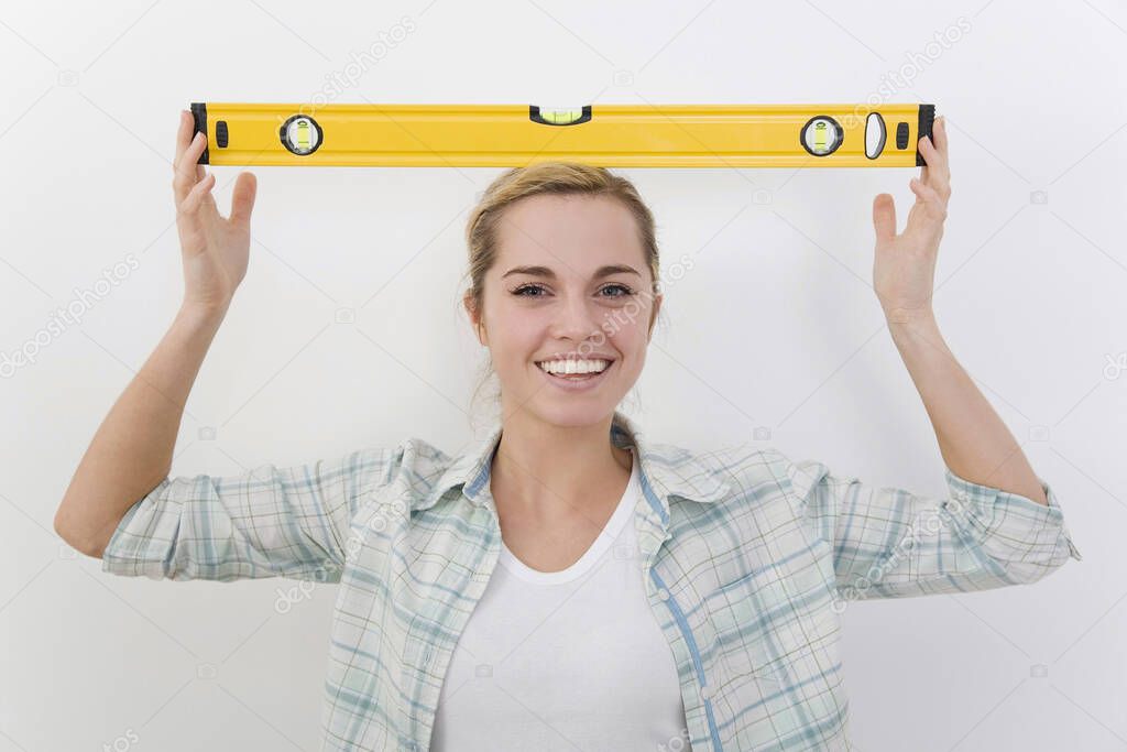 Woman with spirit level on her head