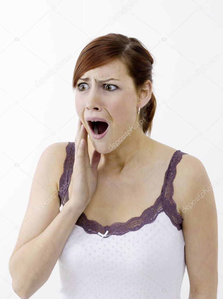Woman in shock on white  on white background 