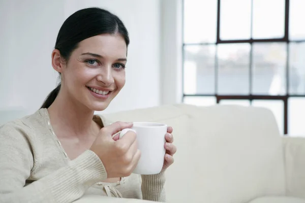 Woman with a cup of coffee