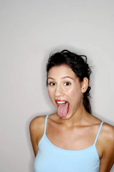 Woman Sticking Out Her Tongue — Stock Photo, Image