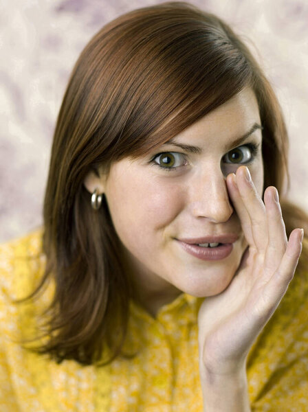 Woman whispering on white background 