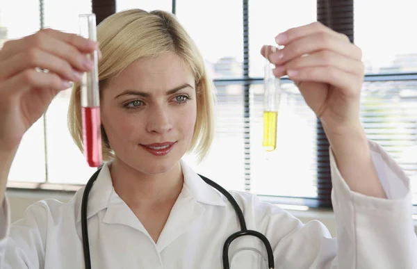 Woman Holding Two Test Tubes — Stock Photo, Image