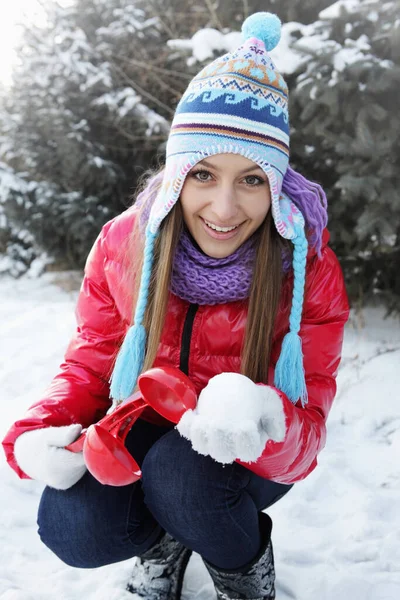 Woman Making Snowball Scoop Stock Picture