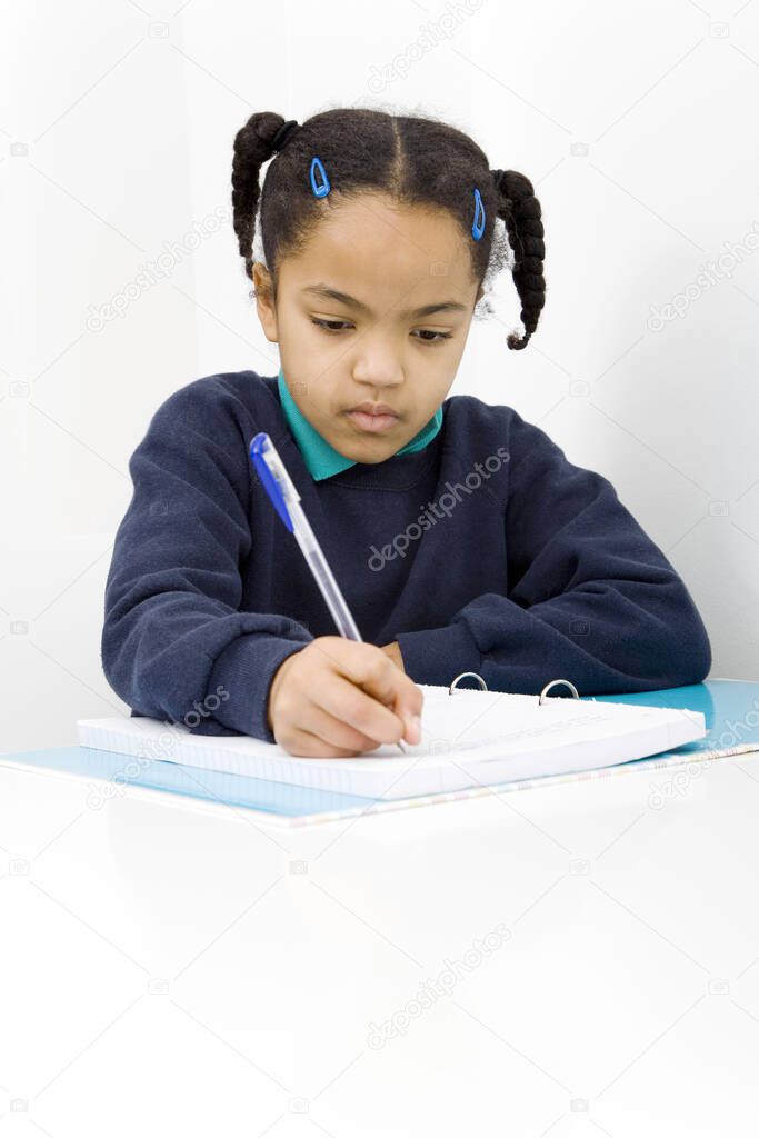 Girl writing on paper