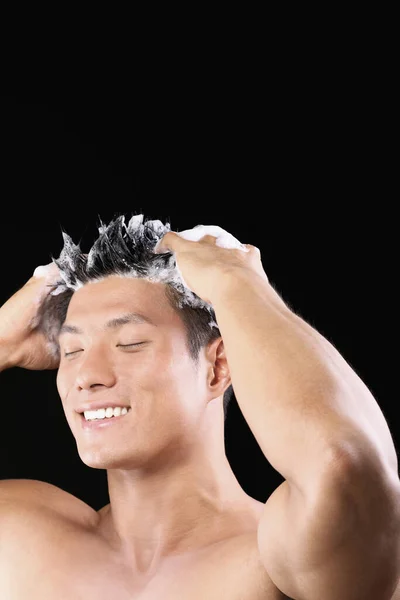 happy man washing hair