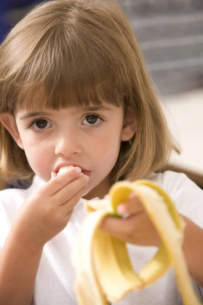 Girl Eating Peeled Banana — Stock Photo, Image