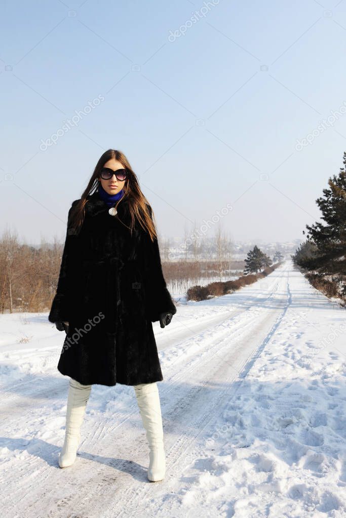 portrait o fBusinesswoman with sunglasses in winter 