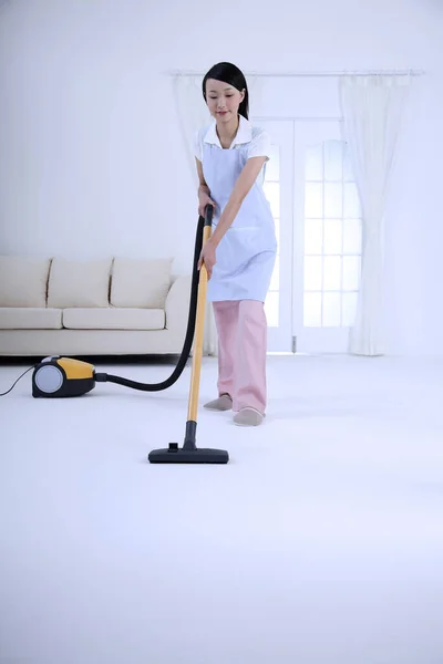 Woman Vacuuming Floor — Stock Photo, Image