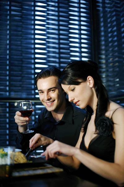 Couple enjoying their meal in a luxurious restaurant