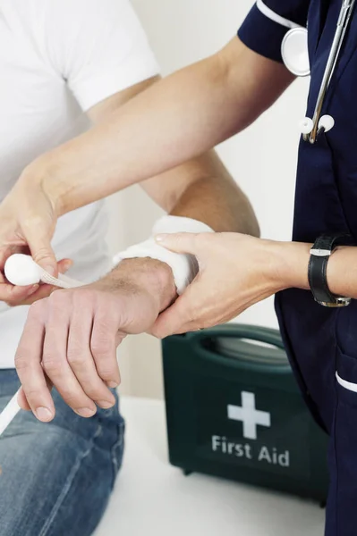 Female nurse treating a patient