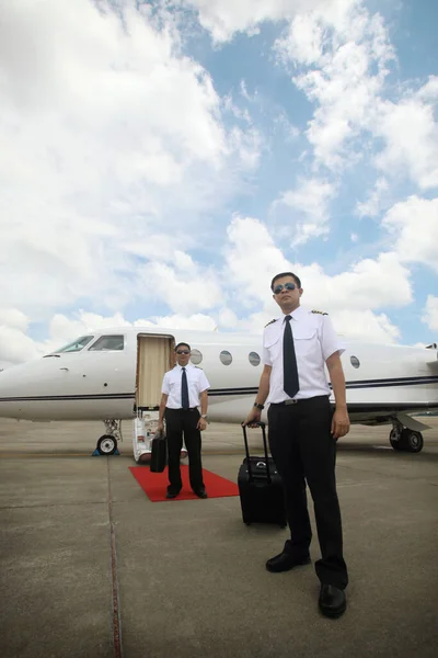 Pilot and co-pilot walking away from private jet